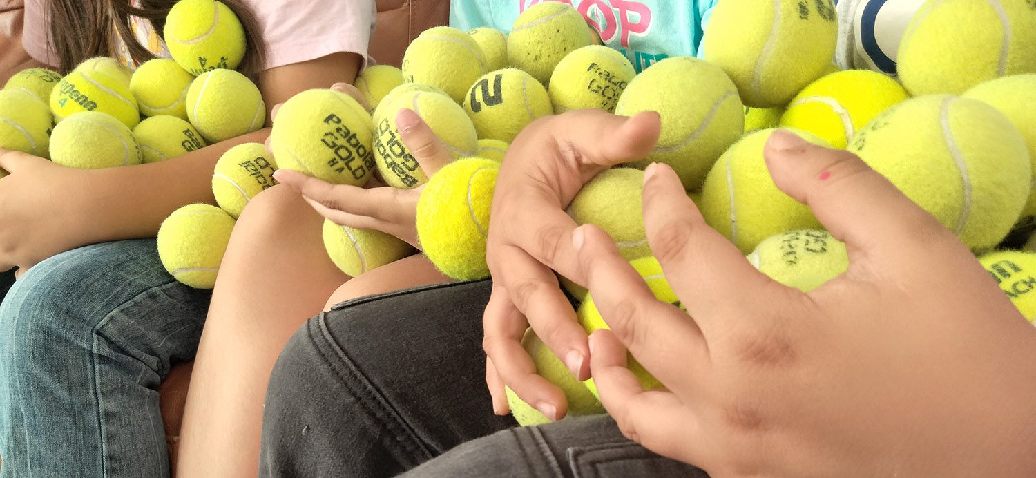 Kids prepare to learn to train their animals using tennis balls.